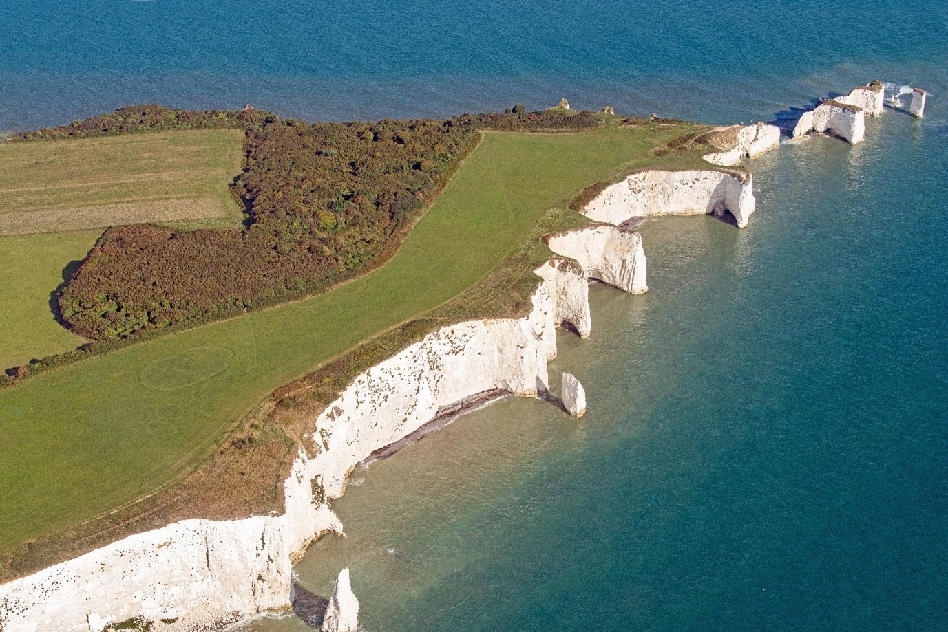 Old Harry Rocks from a drone point of view surrounded by the blue sea